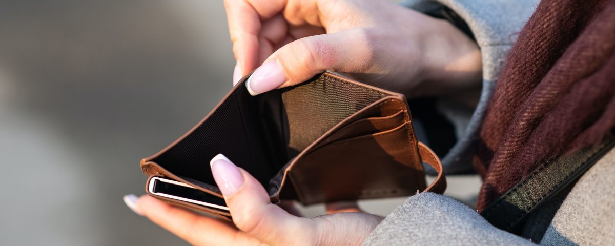 Woman's hands holding open an empty wallet