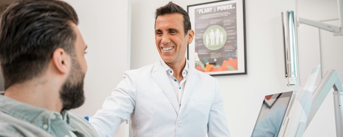 Dentist talking to patient